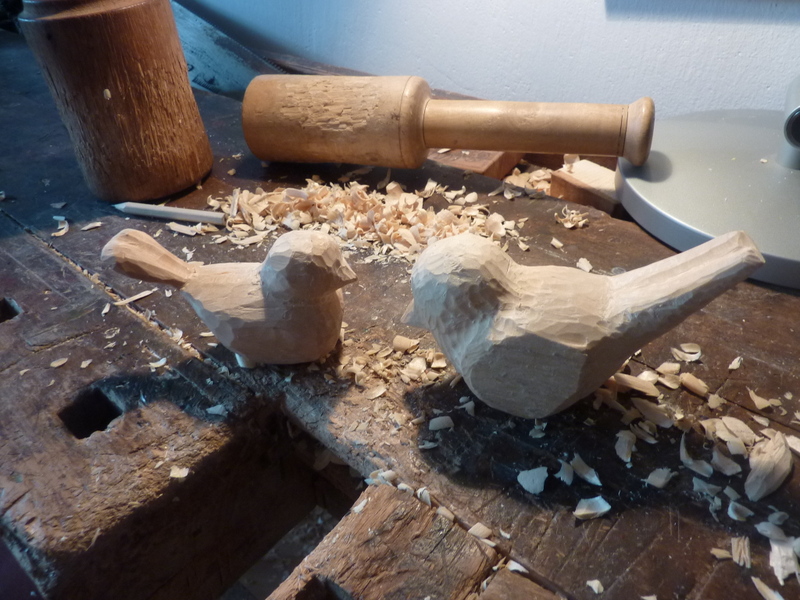 Unfinished carving of two birds